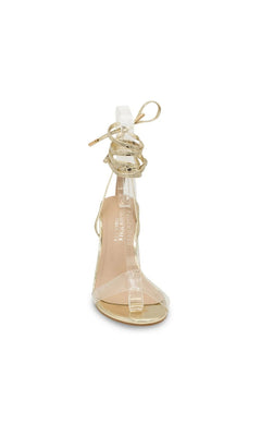 Bowie Gold Block Heel Prom Shoes: Touch Ups 4690 are gold glitter block-heel sandals featuring a clear toe strap and gold wraparound ankle laces.