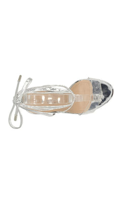 Top-down view of Bowie Silver Block Heel Prom Shoes: Touch Ups 4689, featuring a metallic silver finish, block heel, clear toe strap, and lace-up ankle ties.