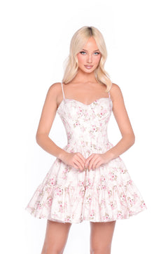 A woman models the Brielle Cream Rose Print Corset Sundress, featuring a corset-style bodice and flared skirt, against a plain white background.