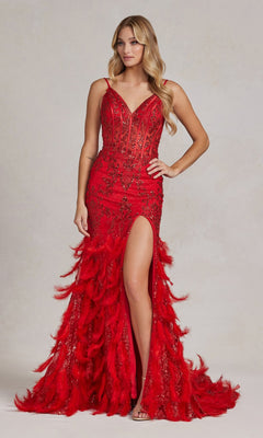 A woman models the Open-Back Shimmer Prom Dress with a feather skirt, showcasing spaghetti straps, a sheer corset bodice, and a high slit, all in red, against a neutral background.