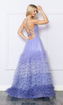 A woman poses in the Nox Anabel Ruffled Ombre Prom Ball Gown C1420, featuring a light purple hue, ruffled details, and a lace-up open back, standing against a light-colored wall.
