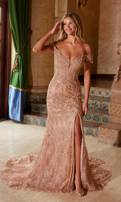 A woman in the Lace-Up Long Beaded Prom Dress: Nox Anabel C1600, a blush off-the-shoulder gown with a thigh-high slit, stands indoors by a tiled staircase and green curtains.