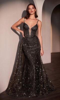 A woman stands indoors wearing the Ladivine C167, a sleeveless, floor-length black glitter prom dress with sparkling embellishments, a deep V-neckline, and a graceful mermaid skirt.