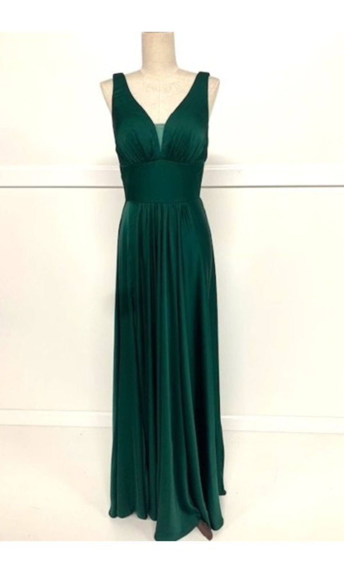 Chicas C242: Empire-Waist Long A-Line Prom Dress in sleeveless dark green with a V-neckline, fitted waistband, and flowing floor-length skirt, shown on a dress form against a plain white background.