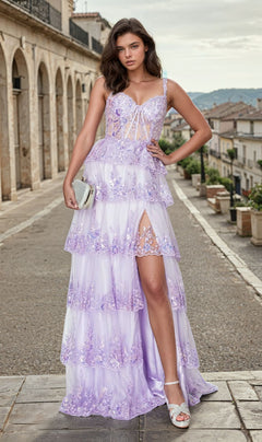 A woman in the Tiered Long Ruffle Prom Dress: Chicas C2433, featuring lavender lace and a thigh-high slit, stands on a cobblestone street with a silver clutch and white heels.