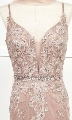 Close-up of the Chicas C243 low-back long mermaid prom dress, featuring a sleeveless blush pink design with floral lace embroidery, beads, and a deep V-neckline displayed on a dress form.