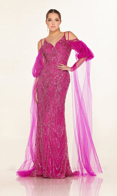 A woman wears the Cecilia Couture C270, a fitted long formal dress in bright magenta with sparkly embellishments, sheer off-the-shoulder sleeves, and flowing tulle drapes.