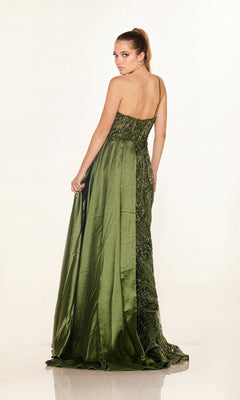 A woman models the Cecilia Couture C275, a green, floor-length, one-shoulder prom dress, standing with her back to the camera and head turned, set against a plain white background.