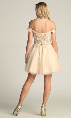 A woman stands facing away, wearing the Beaded-Bodice Short A-Line Homecoming Dress C315, featuring an off-the-shoulder neckline, lace-up back, and tulle babydoll skirt.
