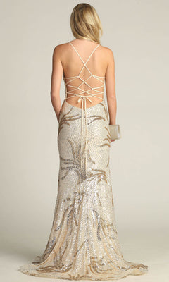 A woman in the Lace-Up Long Sequin Prom Dress: Chicas C316, featuring a backless, floor-length design with crisscross straps, holds a clutch and stands facing away from the camera.