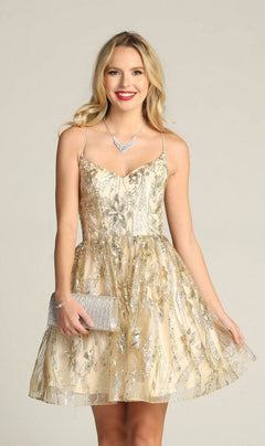 A woman in the Lace-Up Glitter-Print Short Homecoming Dress C317, featuring sleeveless A-line styling and gold and silver embroidery, smiles at the camera holding a silver clutch and wearing a necklace against a plain background.