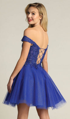 A woman faces away, looking over her shoulder, in the Off-Shoulder Short Glitter Homecoming Dress C318 featuring a lace-up back and shimmering blue details.