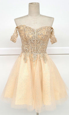 The Off-Shoulder Short Glitter Homecoming Dress C318 is a chic beige A-line cocktail dress with lace embroidery on the bodice and a flared tulle skirt, making it the perfect stylish option for any homecoming event.