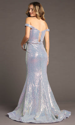 A woman in the Chicas C324 Off-Shoulder Long Sequin Prom Dress stands facing away, holding a clutch. This floor-length dress features iridescent sequins and lace-up back detailing for an elegant evening look.