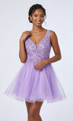 A woman poses against a plain background wearing the Chicas C376 short homecoming dress in lilac—a sleeveless, knee-length design with floral embellishments and a glitter tulle skirt, showcasing a classic fit-and-flare silhouette.