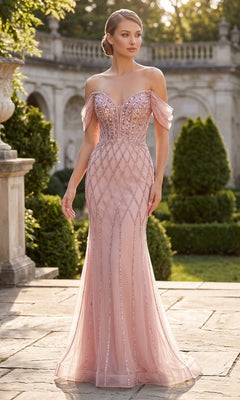 A woman poses outdoors in the Chicas C390 long formal dress in rose gold, featuring an off-the-shoulder beaded bodice and sheer fitted details. Trimmed hedges and stone architecture create an elegant backdrop.