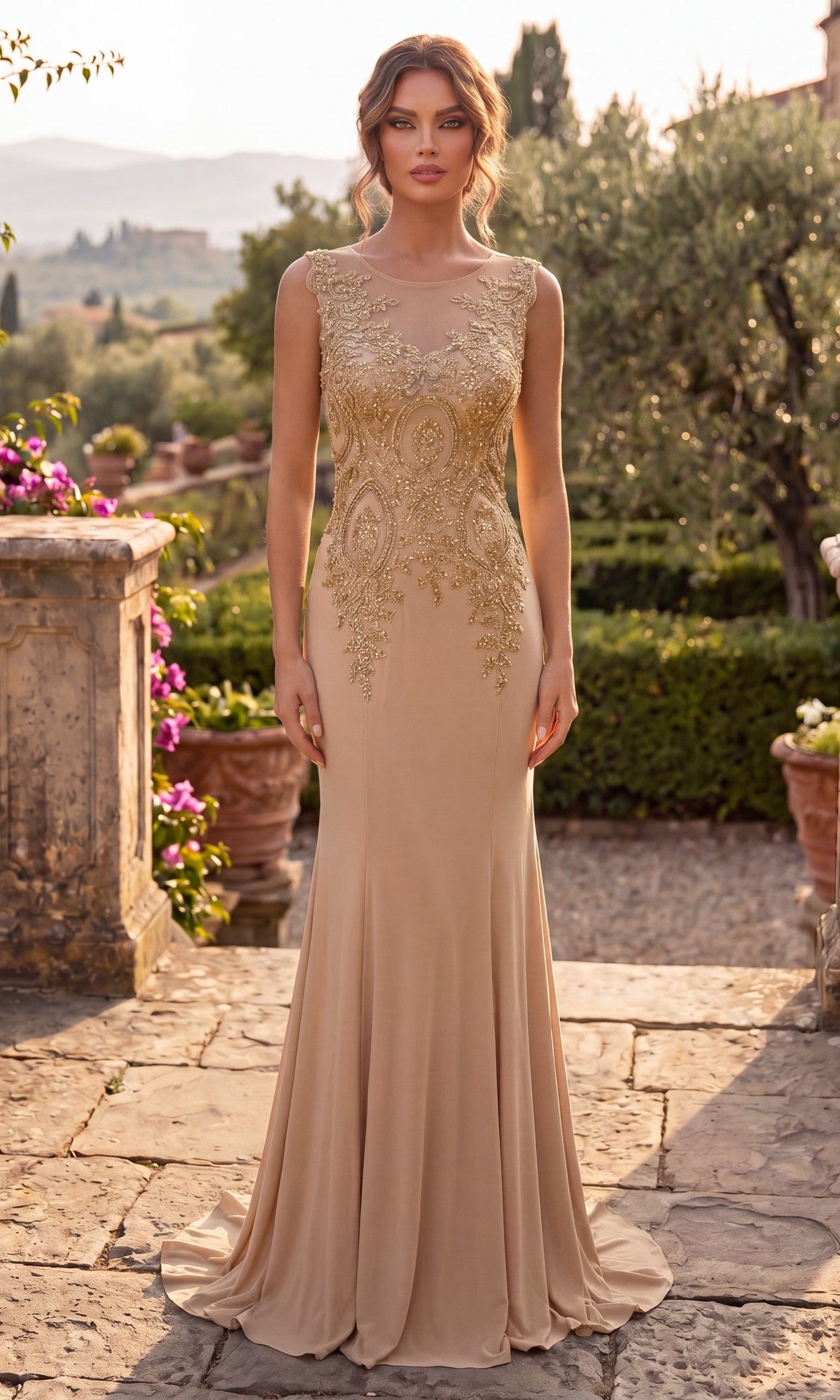 A woman stands on a stone path in a garden setting, wearing the Chicas C4233 Gold-Embroidered Long Prom Dress in taupe and gold.