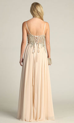 A woman faces away, wearing the Lace-Up Open-Back Long Prom Dress: Chicas C5124, which features a gold embroidered bodice and lace-up back. She holds a small clutch in her right hand.