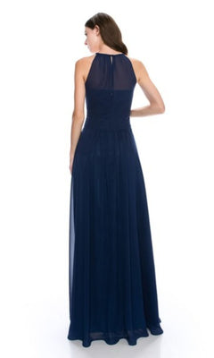 A woman faces away, modeling the Chicas C5150 High-Neck Long A-Line Prom Dress in navy blue with a sheer upper back panel for an elegant, affordable formal look.