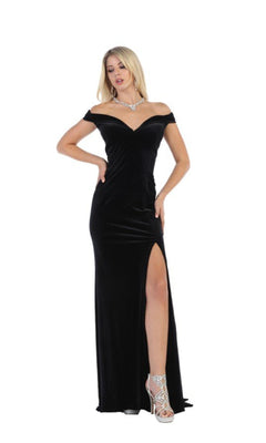 Model wearing the Chicas C6532 Off-the-Shoulder Long Prom Dress in black with a thigh-high slit, paired with silver high-heeled sandals and a necklace, standing against a white background.