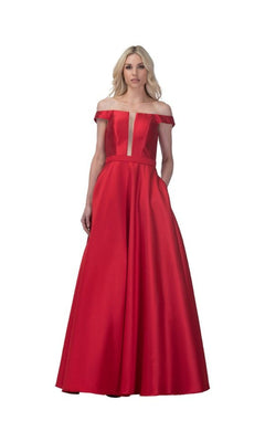 A woman wears the Lace-Up Long Prom Ball Gown: Chicas C7074, featuring an off-the-shoulder design, deep V neckline, and floor-length A-line silhouette, standing against a plain white background.