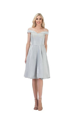 A woman wearing the Chicas C7518 short homecoming dress in silver, featuring an off-the-shoulder neckline, short sleeves, and a pleated a-line knee-length skirt, stands smiling against a white background.