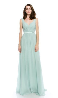 A woman poses against a white background in the Deep V-Back Long A-Line Prom Dress: Chicas C7818—a sleeveless, floor-length, light blue-green gown with a V-neckline and gathered waist, ideal for elegant evenings.