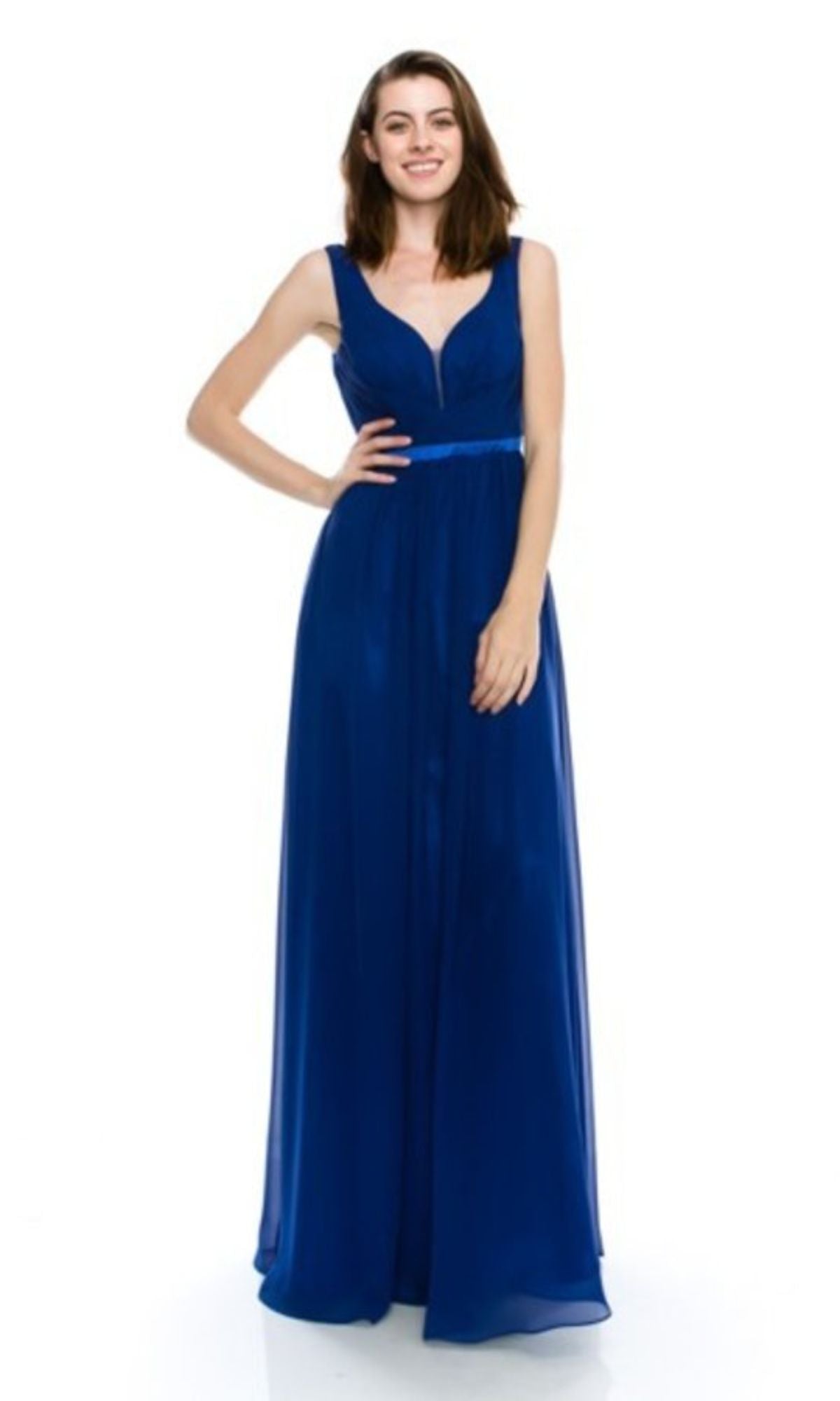 Woman smiling in the Deep V-Back Long A-Line Prom Dress: Chicas C7818, a sleeveless, floor-length royal blue gown with a fitted bodice and V-neckline, set against a plain white background.