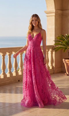 A woman in the Long Prom Dress: Chicas C804, a sleeveless floor-length gown in fuchsia, with floral lace embroidery, stands on a sunlit balcony overlooking the coast, framed by elegant stone columns.