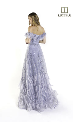 Woman in an off-the-shoulder, lavender feathered Long Prom Dress (Lucci Lu C8052) stands facing away on a white background. The sequin-embellished Lucci Lu logo appears in the top right corner.
