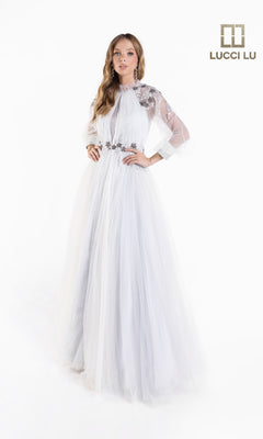 A woman models the Lucci Lu C8057 Long-Sleeve A-Line White Formal Dress, featuring sheer sleeves and floral embellishments, standing on a white background beside the Lucci Lu logo.