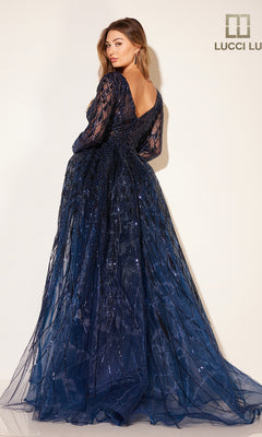 A woman poses against a light background in the Lucci Lu C8095 long formal dress, featuring dark blue sequins, sheer sleeves, an open back, and a hint of tulle overskirt.