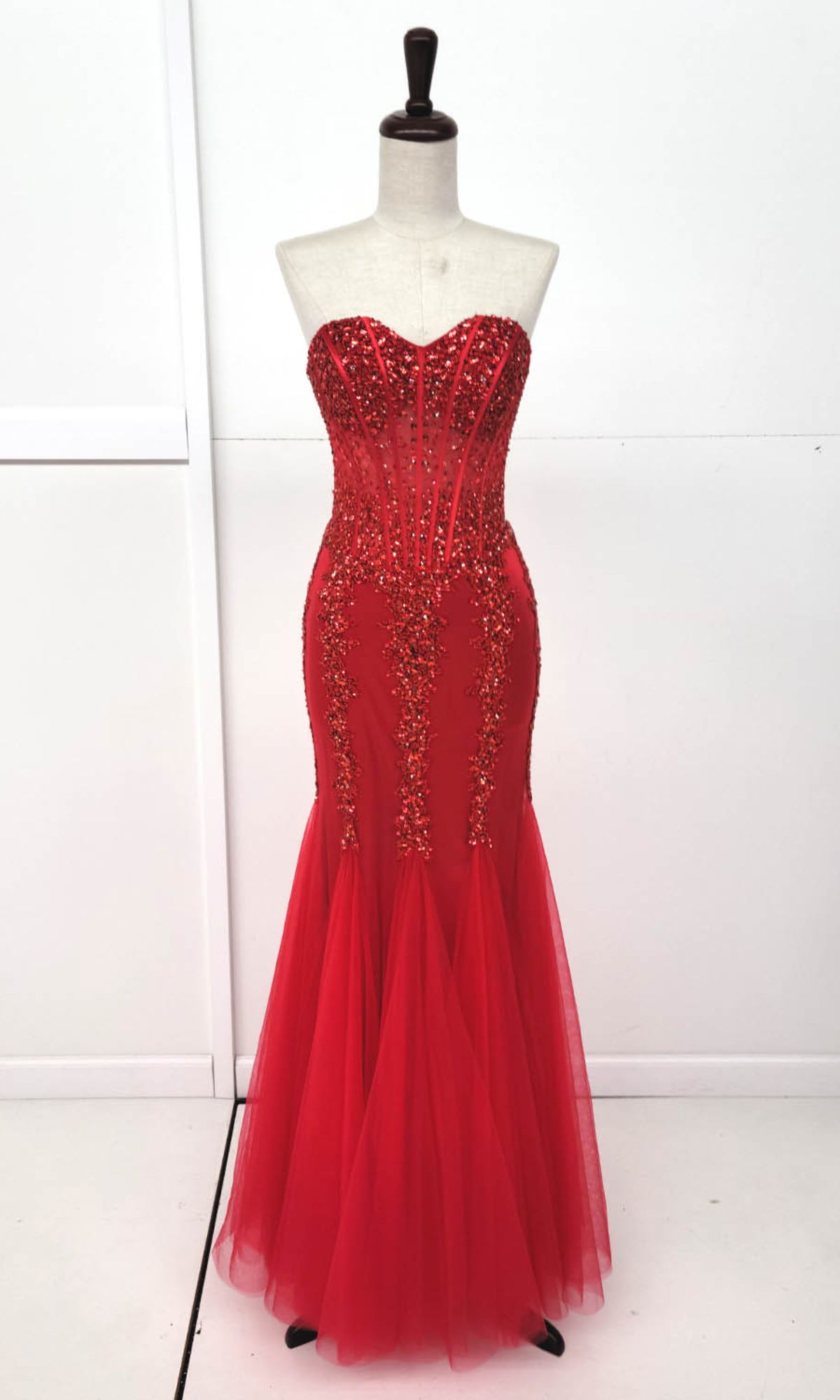 Strapless Long Mermaid Prom Dress: Chicas C820 in vibrant red with beaded embellishments, shown on a dress form against a plain white background.