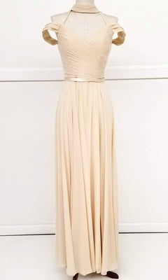 The Chicas C8997 is a long A-line off-shoulder prom dress in cream, featuring a pleated bodice and flowing skirt, displayed on a dress form against a plain white background.