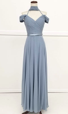 The Chicas C8997 Long A-Line Off-Shoulder Prom Dress is shown in light blue on a mannequin, featuring a ruched bodice, matching neck scarf, and flowing floor-length skirt.