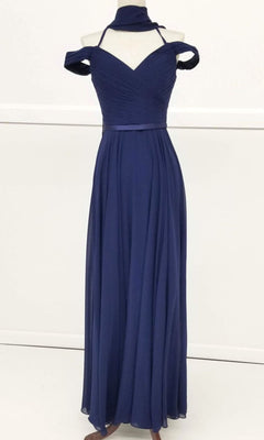 The Long A-Line Off-Shoulder Prom Dress: Chicas C8997, featuring a fitted bodice, pleats, and matching neck scarf in navy blue, is displayed floor-length on a mannequin against a plain background.
