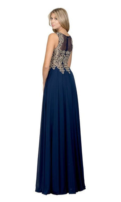 A woman stands facing away in the Gold-Lace Bodice Long Prom Dress: Chicas C9156—a floor-length navy A-line gown with sheer black and gold embroidered lace detailing on the upper back.