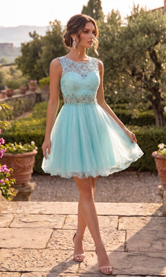 A woman wearing the Chicas C9350 Lace-Bodice Mini Hoco Dress in aqua, featuring a delicate lace bodice with tulle and floral details, stands outdoors on a stone path amid lush greenery and potted plants.
