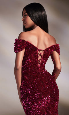 A woman stands gracefully in the Magenta Pink Off-Shoulder Long Prom Dress CA109, featuring sparkling sequins and a lace-up back, looking to the side.