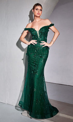 A woman stands against a neutral background wearing the Emerald Green Off-Shoulder Long Prom Dress CB096, featuring a fitted silhouette, floral embellishments, and a sheer bodice panel.