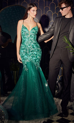 A woman wears the Butterfly Emerald Green Mermaid Prom Dress CB112, standing beside a man in a black suit and sunglasses at a formal event.