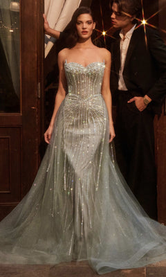 A woman in the Ladivine CB158 Strapless Glitter-Tulle Prom Gown captivates with sparkling elegance.