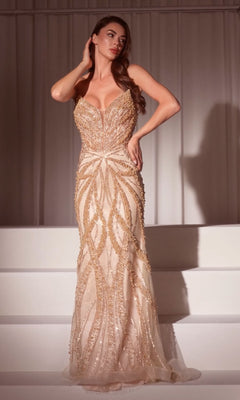A woman stands on white steps wearing the Ladivine CC0688, a strapless long beaded prom dress featuring a fitted mermaid silhouette, sweetheart neckline, intricate patterns, and a flattering corset bodice.