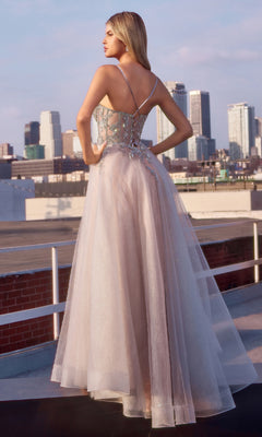 A woman stands gracefully in the Sheer-Corset Long Prom Dress: Ladivine CC0881, its formal A-line silhouette elevated by intricate beaded embroidery.