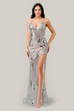 A woman models the Embellished Long Prom Dress with High Slit CC2292, featuring silver beading, spaghetti straps, and a thigh-high slit, against a plain light background.