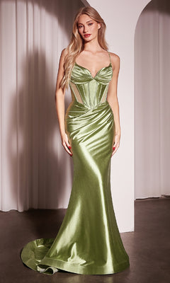 A woman stands indoors against a white curtain and arched doorway wearing the Ladivine CC2397 Long Corset Glitter Prom Dress—shiny, light green, fitted, with a structured bodice and mermaid silhouette.