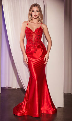 A woman wearing the Lace-Up Long Corset Prom Dress: Ladivine CC2401, a fitted satin gown with a beaded corset bodice and thin straps, stands before sheer white curtains.