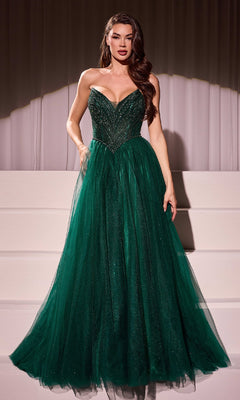 A woman wearing the Beaded-Bodice Long Prom Dress: Ladivine CC415, a strapless dark green gown with a fitted, embellished bodice and floor-length skirt, stands before a white curtain backdrop.