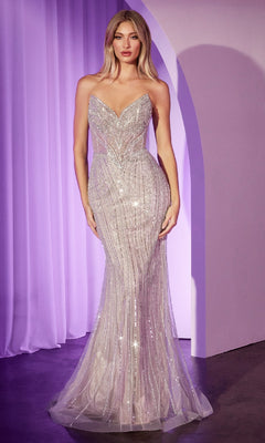 A woman stands in front of a lavender curtain wearing the Ladivine CC416, a strapless long sequin prom dress with a fitted silhouette and slight mermaid flare.