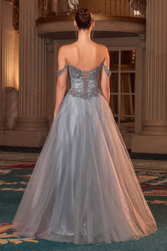 Woman showing the back of Ladivine CC471, a glitter tulle evening gown with intricate detailing, standing in an elegant indoor setting